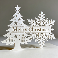 White custom-shaped Christmas card with laser engraving.