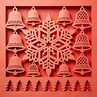 Laser-cut red Christmas greeting card with intricate cutout patterns.