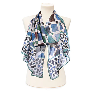 The chiffon scarf features intricate patterns with smooth, sealed edges.