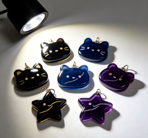 Small acrylic pendants cut from black acrylic sheets using a diode laser.