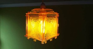 Laser-cut acrylic lighting fixture with clean edges.